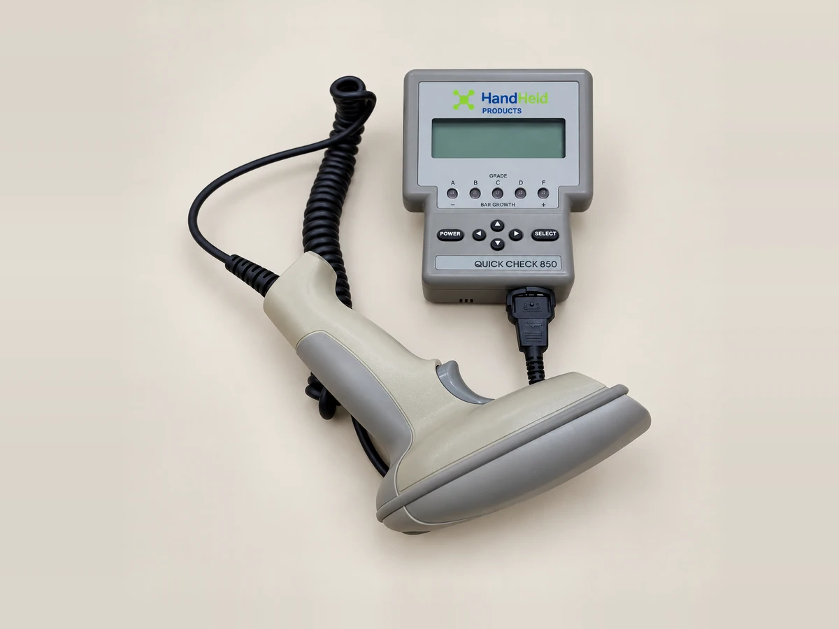 Quick Check 850 barcode grader with its display unit, keypad and hand-held scanning wand