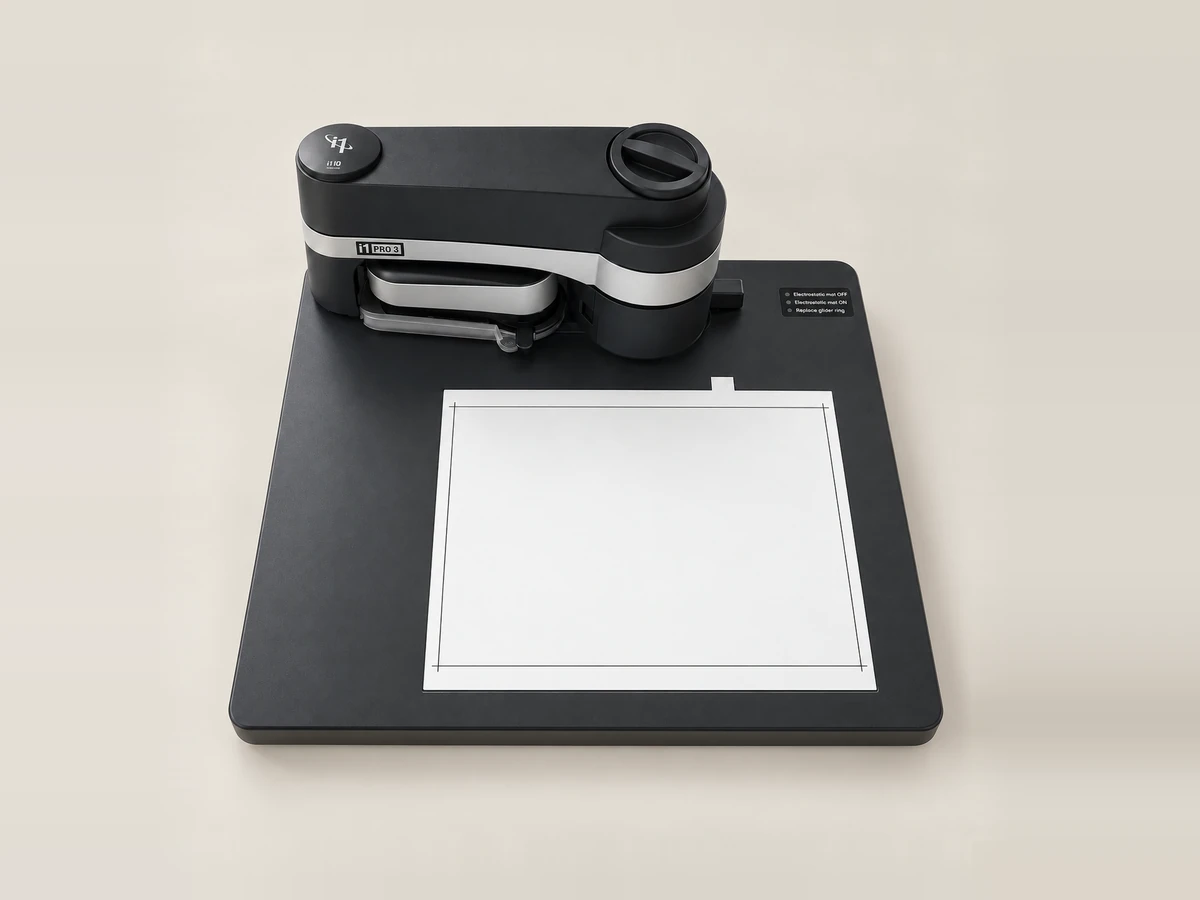 X-Rite i1Pro 3 spectrophotometer on its i1iO automatic scanning table above a printed chart