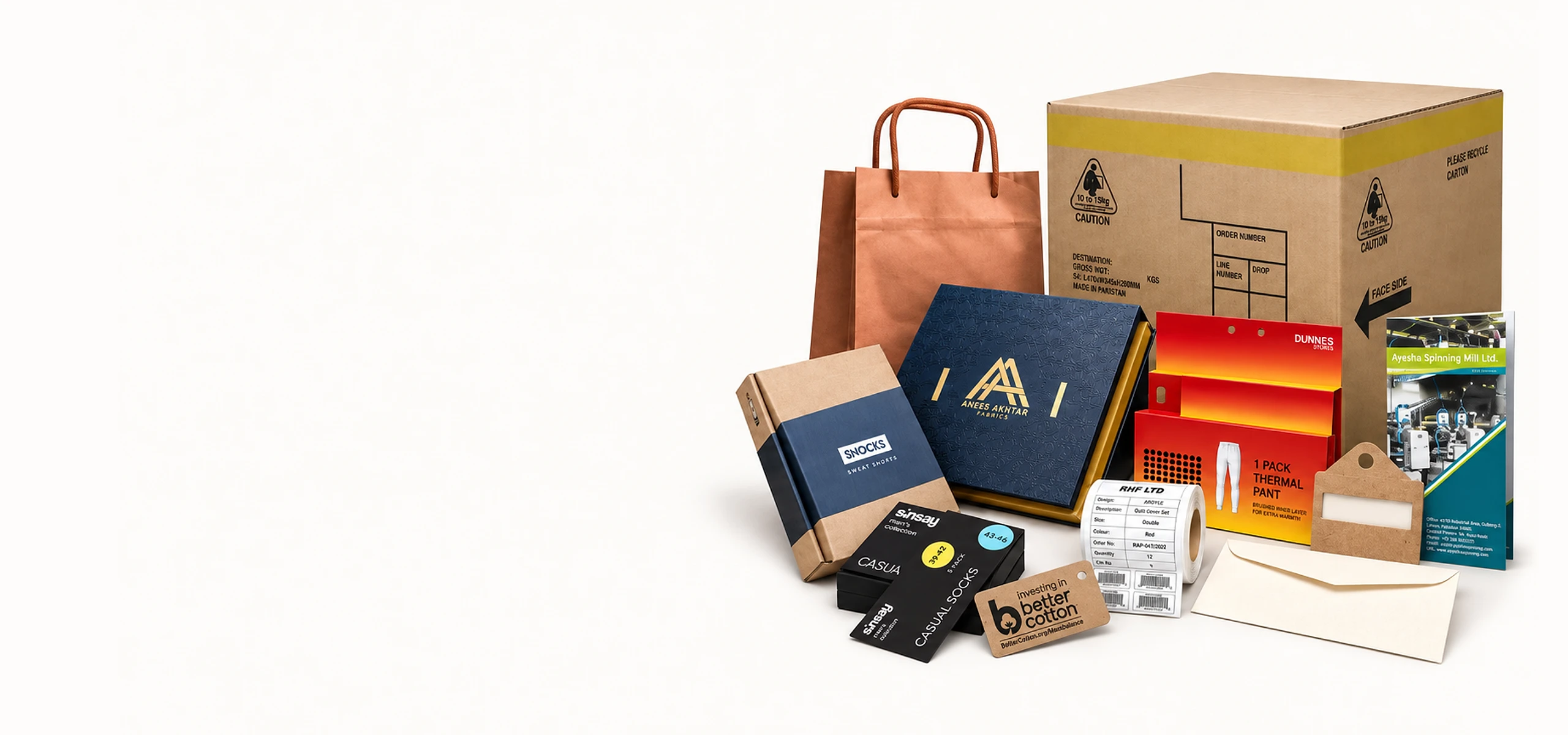 A group of ZHP printed and packaged products from every category: a shopping bag, rigid gift box, corrugated carton and mailer, swing tags and labels, a card hanger and cascading card, a brochure and an envelope